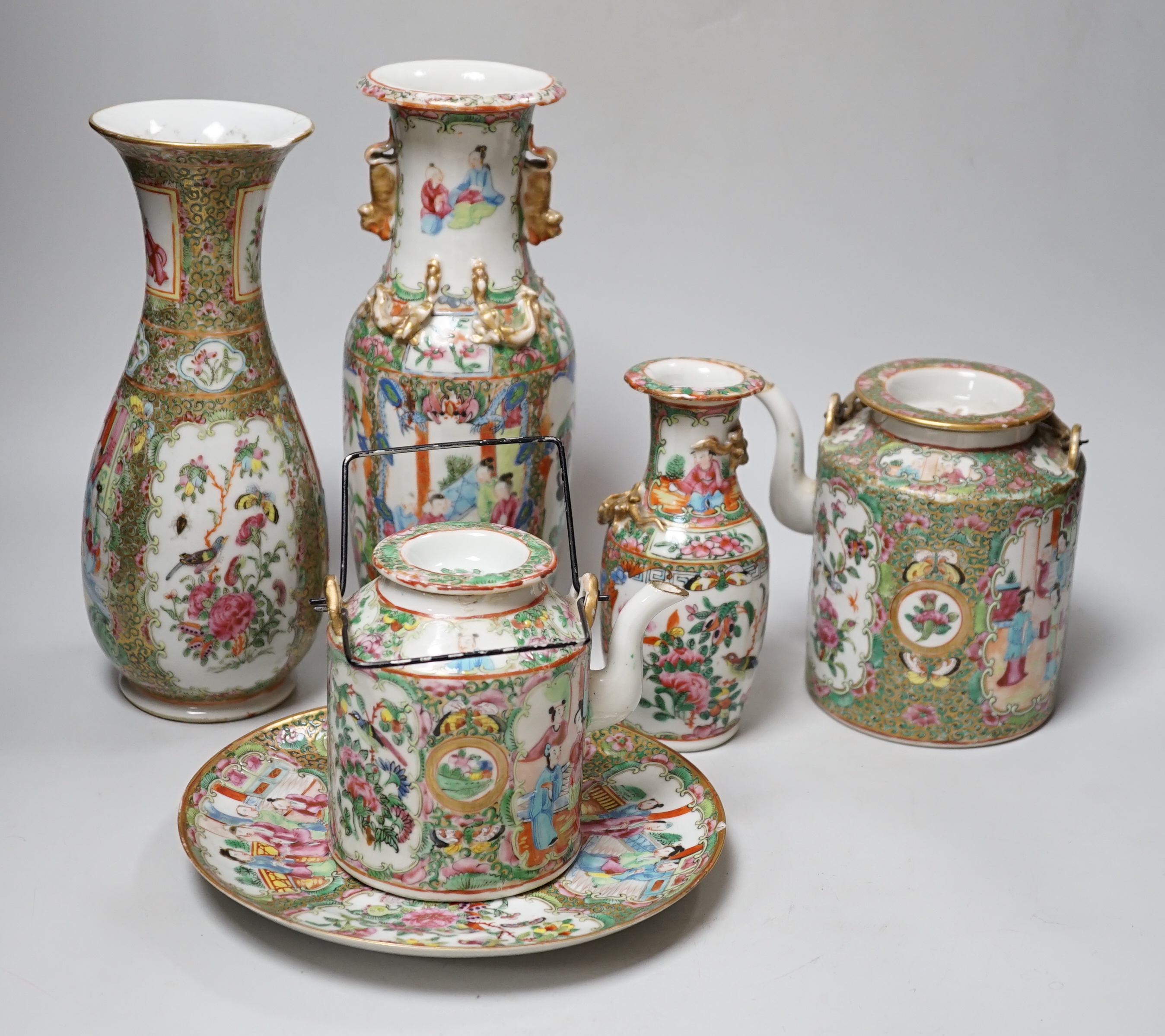 A collection of Chinese Cantonese famille rose vases, two teapots and a plate